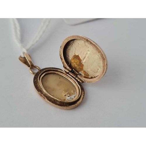 360 - A oval locket set with three sapphires 9ct    2.8 gms