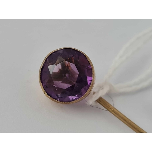 387 - A gold and amethyst stick pin    1.8 gms