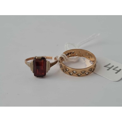 44 - A white stone ring size N   together with a garnet ring size K AF   both 9ct    3.8 gms inc