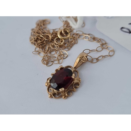 5 - A single stone garnet pendant 9ctt on 9ct chain 16 inch