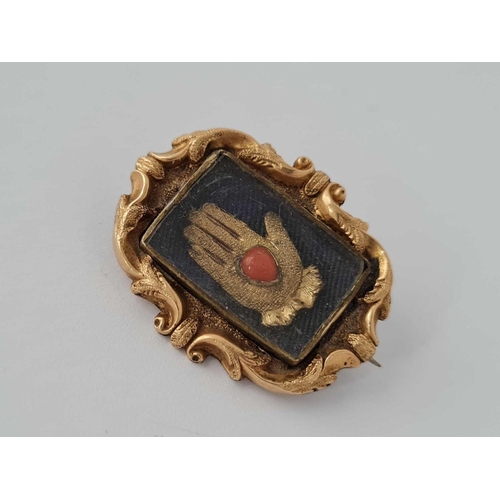 53 - A Georgian gold brooch with hand set coral stone