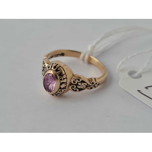 78 - A small ladies 10k college ring set with pink sapphire or tourmaline size J 3g inc