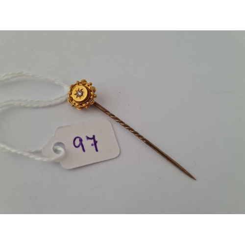 97 - A gold and diamond stick pin 15ct gold    1.6 gms