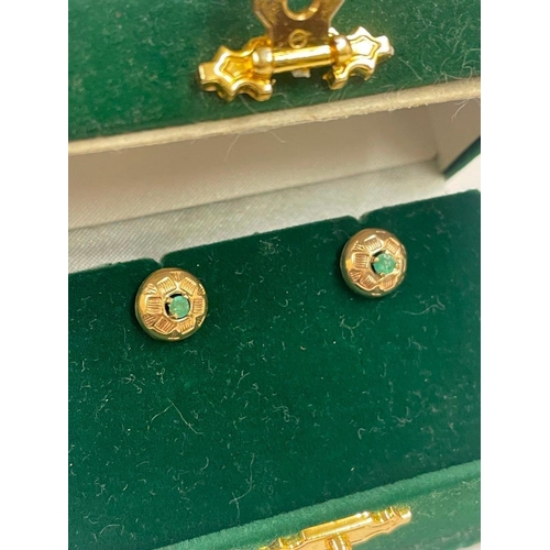 180 - A attractive pair gold and emerald ear studs in fitted box