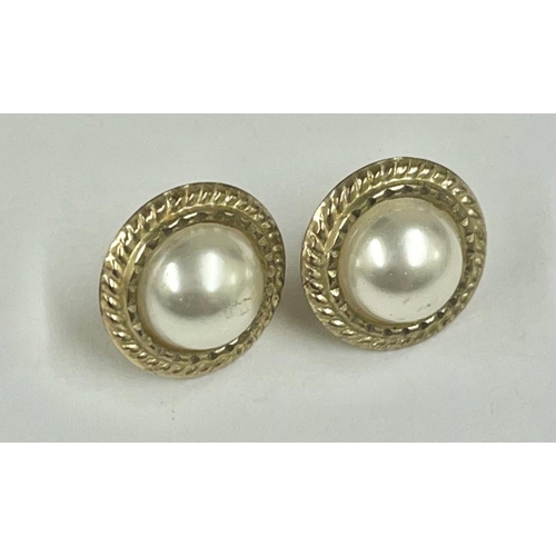 202 - A pair of gold and pearl ear studs braided design 9ct