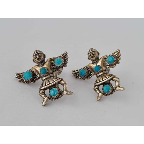 3 - A pair of unusual silver and turquoise Aztec style earrings in form of warriors