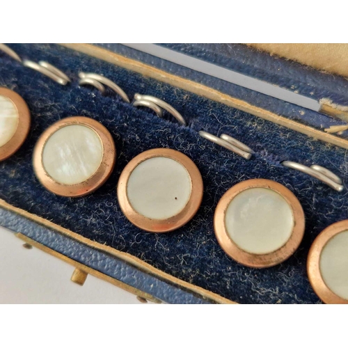 107 - A cased set of six gold and mother of pearl buttons