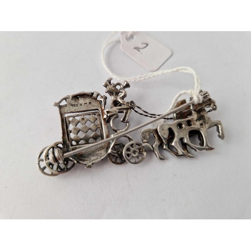 2 - A silver and marcasite horse and carriage brooch