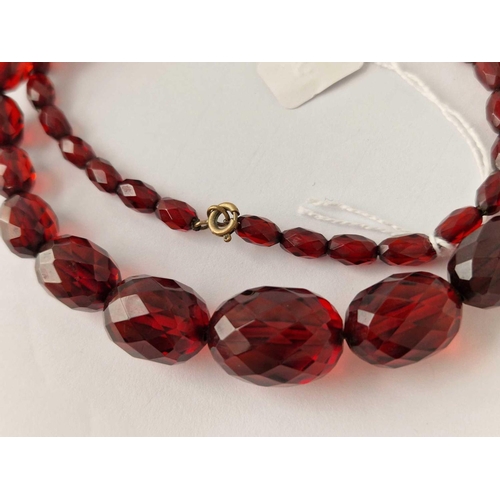 203 - A string of faceted cherry Bakelite beads approx 20� long