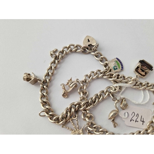 224 - Two silver charm bracelets, 53 g.