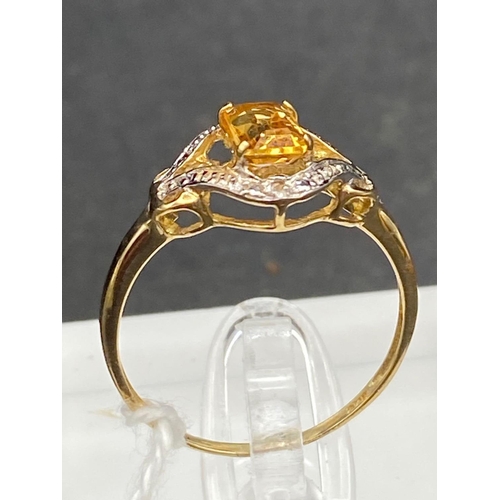 237 - A imperial topaz and diamond ring 9ct size O