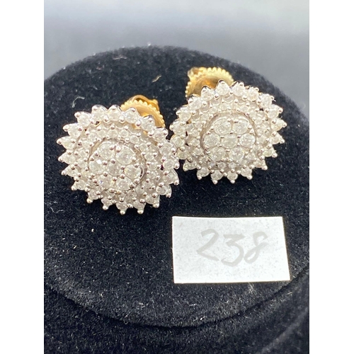 238 - A pair of large diamond cluster earrings with safety screw fittings