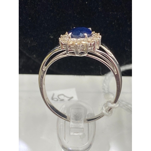 239 - A fine oval sapphire and diamond cluster ring 14ct gold size N