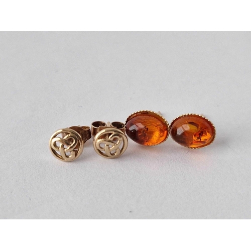 247 - Two pairs of amber Celtic ear studs 9ct