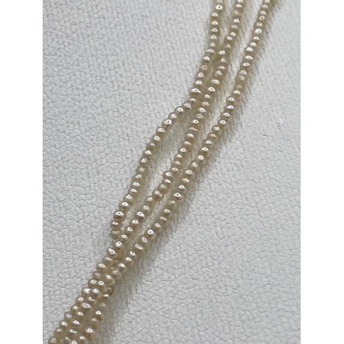 25 - A Antique three row seed pearl necklace to platinum and gold barrel clasp 14 inch