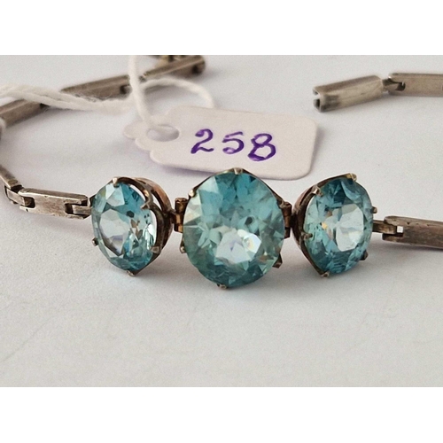 258 - A early 20th century silver and gold set blue zircon bracelet AF clasp