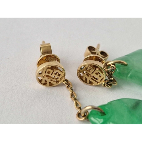 260 - A pair of Chinese gold and jade fish design earrings 14ct gold