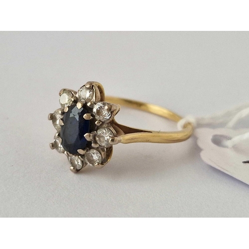 285 - A SAPPHIRE AND DIAMOND CLUSTER RING 18CT GOLD SIZE O   3.6 GMS