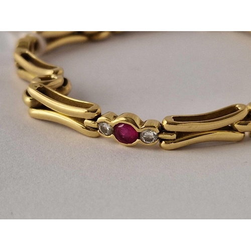 324 - A PRETTY DIAMOND AND RUBY BRACELET, 18ct, 7�