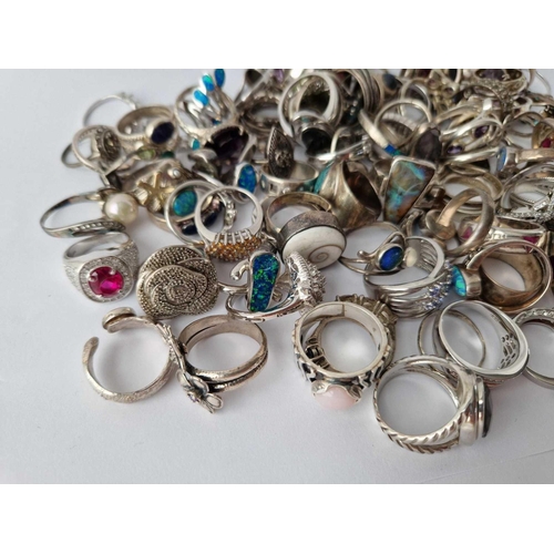 329 - A HUGE QUANTITY OF ASSORTED SILVER RINGS, 518 g.