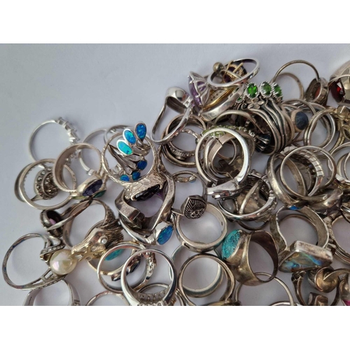 329 - A HUGE QUANTITY OF ASSORTED SILVER RINGS, 518 g.