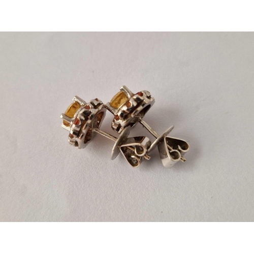 334 - A pair of good white gold yellow stone ear studs 18ct gold 5.5 gms