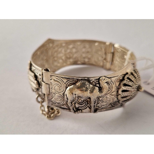 370 - An attractive fancy Egyptian hinged bangle with camels decorations