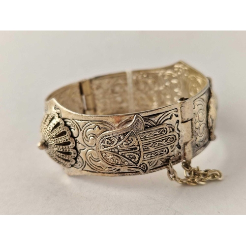 370 - An attractive fancy Egyptian hinged bangle with camels decorations