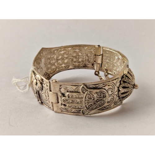 370 - An attractive fancy Egyptian hinged bangle with camels decorations