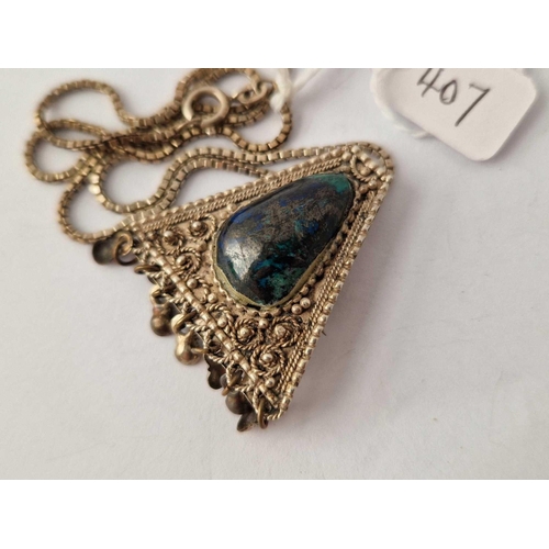 407 - An Israeli triangular lapis set pendant on silver chain, 16 inch