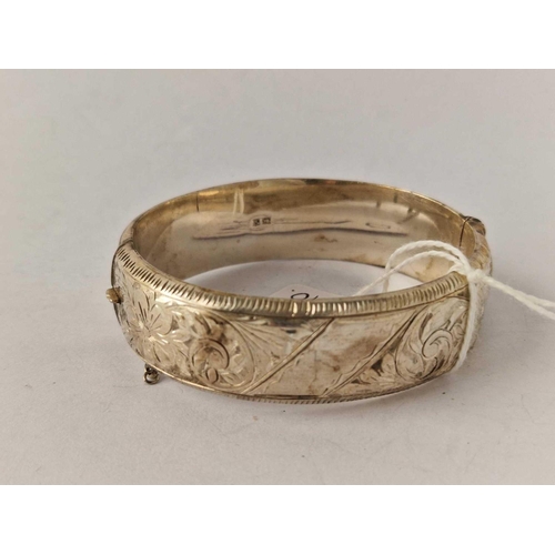 410 - A good wide engraved silver hinge bangle