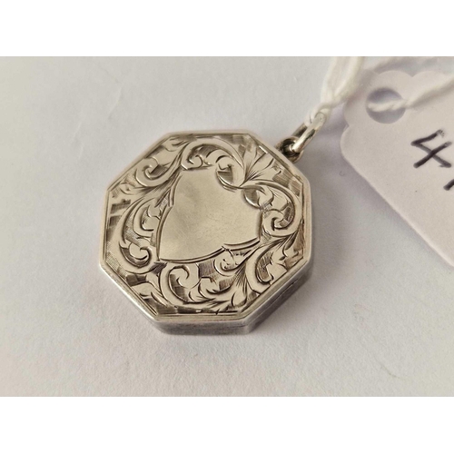 415 - Antique silver octagonal locket, hallmarked Birmingham 1913 with scroll decoration