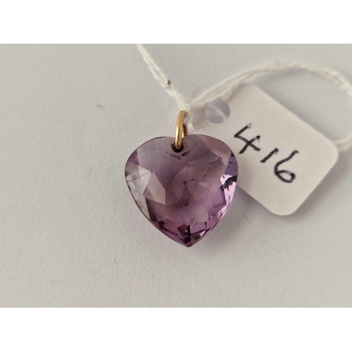 416 - Antique amethyst heart pendant with 15ct gold stamped pendant bale