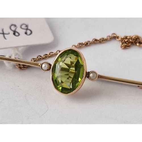 488 - A peridot and pearl brooch 9ct