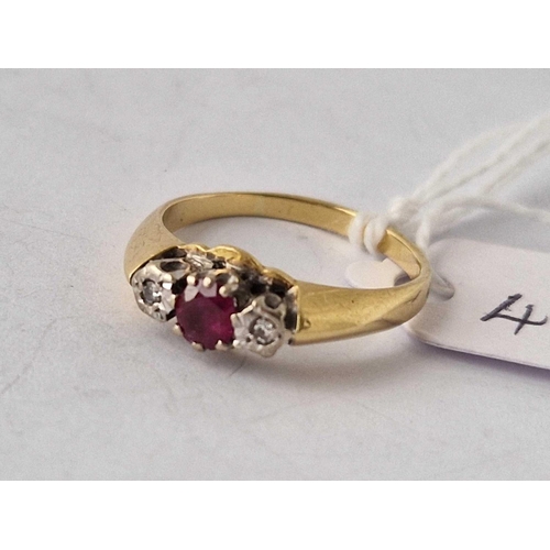 491 - A three stone ruby and diamond ring, 18ct, size M, 3.4 g.