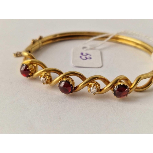 53 - A VICTORIAN CABOCHON GARNET AND DIAMOND BANGLE 15CT GOLD TESTED BOXED