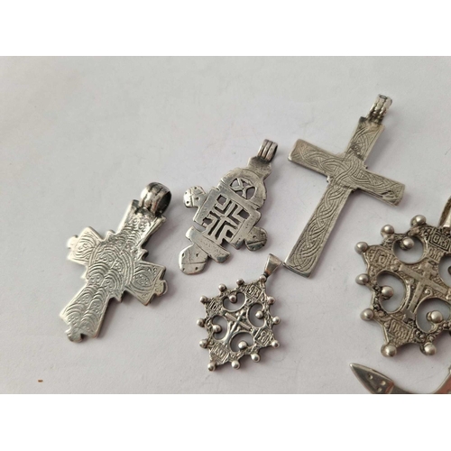 530 - Seven assorted silver crosses, 61 g.