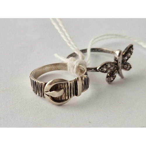 541 - A butterfly and buckle silver rings