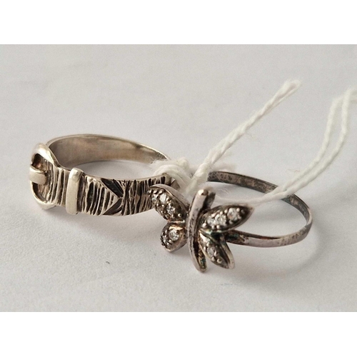 541 - A butterfly and buckle silver rings