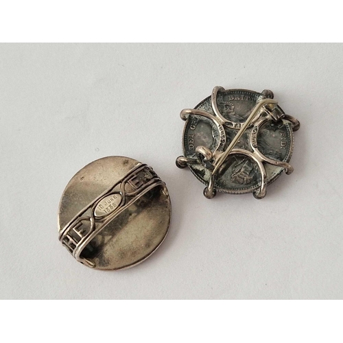 550 - Two silver coin brooches