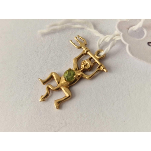 578 - A high carat gold devil charm with peridot 1.1 gms