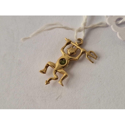 578 - A high carat gold devil charm with peridot 1.1 gms