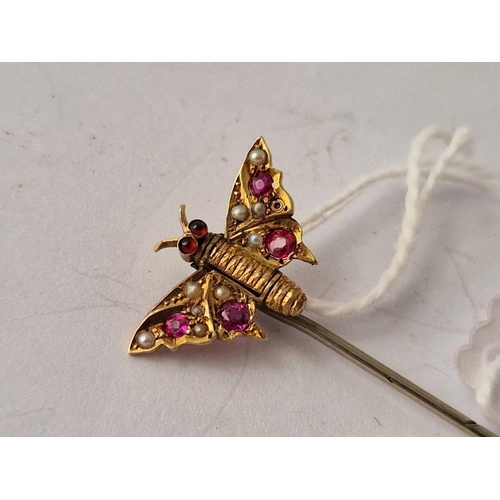 601 - A gold top butterfly stick pin with rubies and pearls