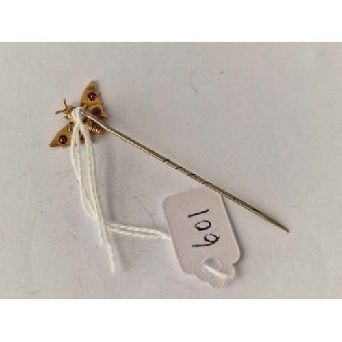 601 - A gold top butterfly stick pin with rubies and pearls