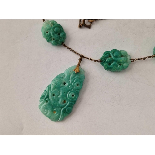 61 - A carved green stone vintage necklace