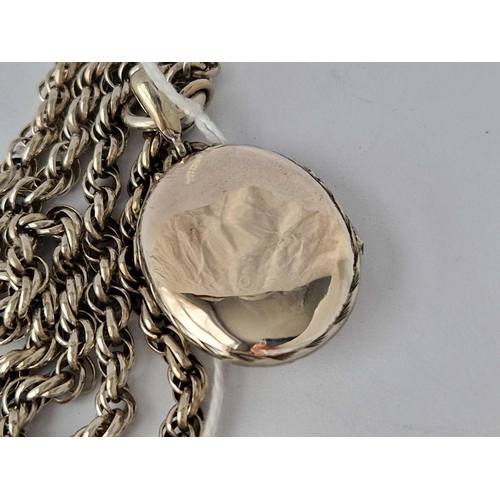 611 - Victorian silver oval embossed locket, suspended from a rope link silver collar  �80