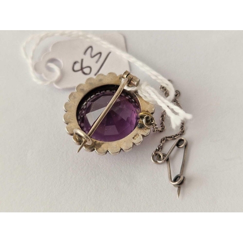 83 - A silver amethyst and pearl brooch