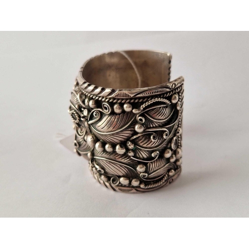 92 - A large stylistic silver bangle 137 gms