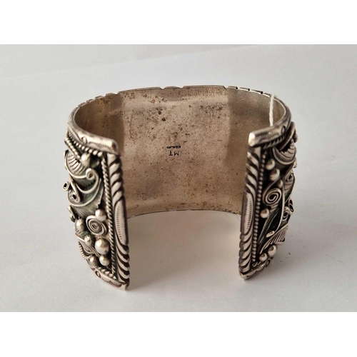 92 - A large stylistic silver bangle 137 gms