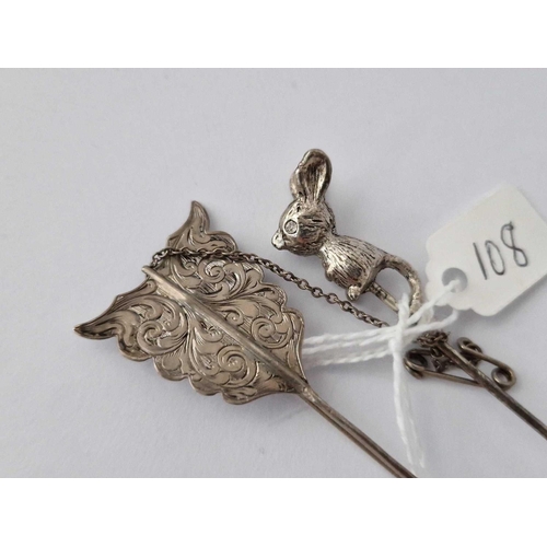 108 - A White Metal Mouse Toped Stick Pin Together With A Silver Arrow Brooch